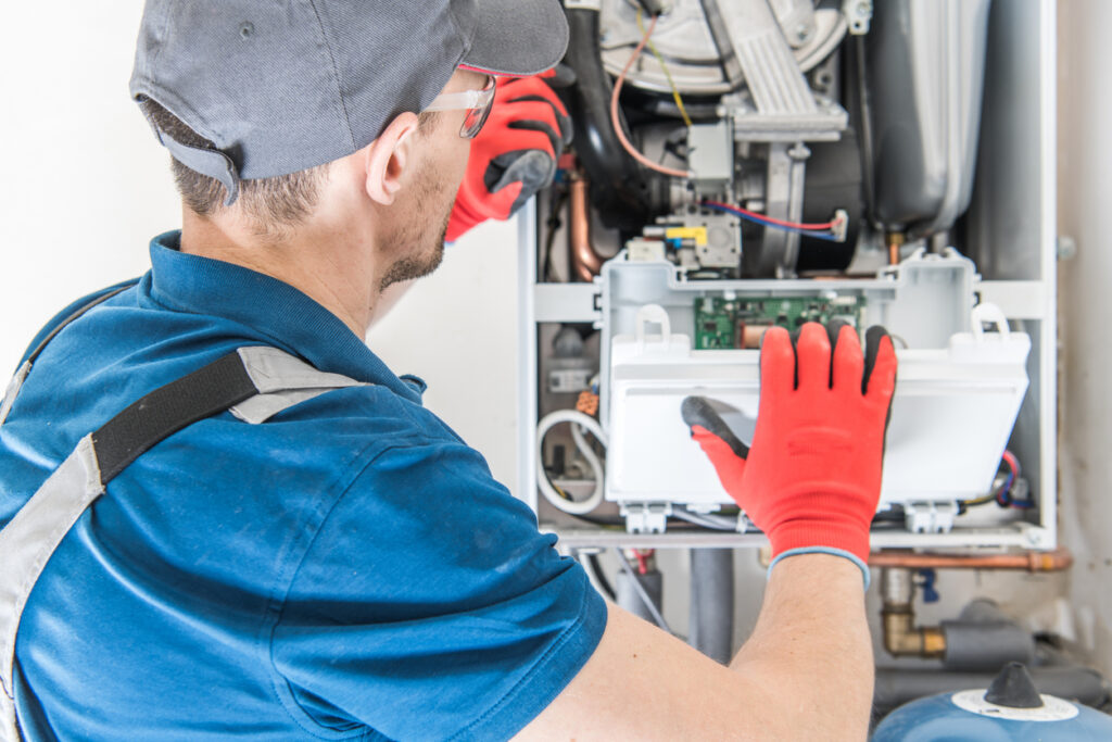 Technician working on a furnace.